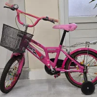 دوچرخه دخترونه و دو درب چوبی تمیز فوری زیر قیمت