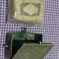 قرآن مینیاتوری چاپ سنگی با قاب نقره حکاکی شده