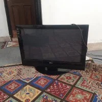 تلویزیون ال سی دی الجی ۳۲ اینچ با میز شیشه ای