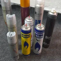 تعدادی قوطی خالی تافت وگازفندک