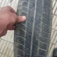 یک عدد لاستیک ۵۰ درصد و رینگ تیبا باد شده اماده