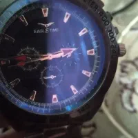 ساعت مچی  ودروبین عکاسی