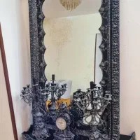 آیینه قدی و کنسول به همراه ساعت و شمعدان