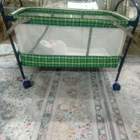 گهواره تاشو و چرخ دار
