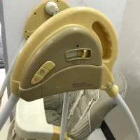 تاب برقی موزیکال کودک و یک صندلی غذا