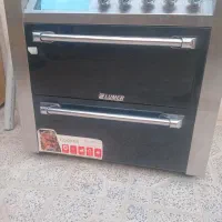 یک اجاق گاز در حد نو کاملآ سالم