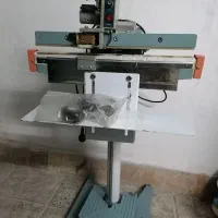 دستگاه دوخت وتاریخ زن
