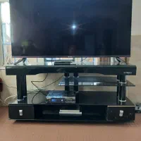 زیر تلویزیونی دو عدد شیشه خم سالم