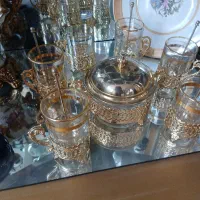 ۶عدد استکان وقاشق برنجی قدیمی وقندان