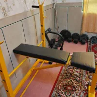 میز پرس و ادوات بدنسازی و دمبل و هالتر