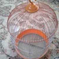 قفس پرنده بدونه عیب خوش رنگ نارنجی سفید