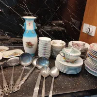 نعلبکی بشقاب کفگیر ملاقه گلسرخی دیوارکوب