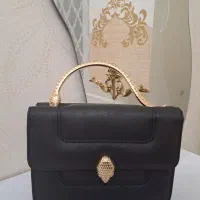 کیف مشکی مجلسی دسته فلزی ماری