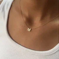 حلقه ساده و تک نگین با حکاکی و گردنبند حروف استیل