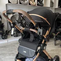 کالسکه کیدیلو مدل 6600 پرو مشکی‌بدنه طلایی