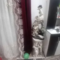 مجسمه وآیینه وگلدان