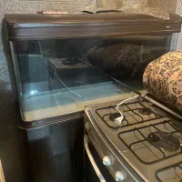 آکواریوم ۱متر و نیم  شیشه خم با کمد چرخ دار