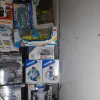 یه تعداد اسباب بازی به صورت یکجا کف کف قیمت