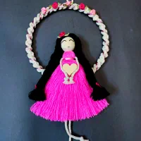 دیوارکوب عروسک