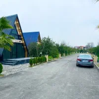 زمین ،کلبه سوئیسی شهرکی داخل باغ مرکبات