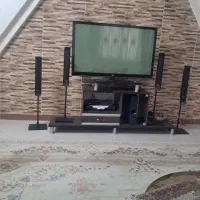 تلوزیون و کمد میز تلوزیون و بوفه و چهار تا فرش