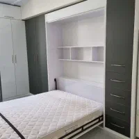 تخت خواب تاشوی دیواری.وکتابخانه