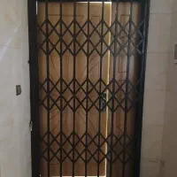 حفاظ  اکاردئونی ثابت در ورودی پنجره مغازه باغ منزل