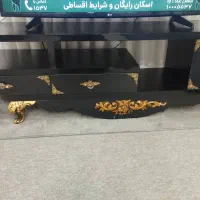 میز تلویزیون وساعت دیواری دو متوره