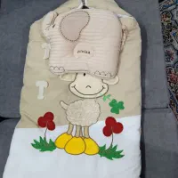 کیسه خواب نوزاد به بالشت شیردهی