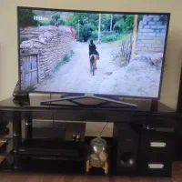 میز زیر تلویزیون شیشه ای