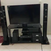 میز تلویزیون بهمراه دستگاه پخش و بلندگو