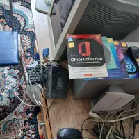 کامپیوتر با میز و صندلی و مودم و انواع دی وی دی