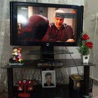 تلویزیون Jvc همراه میز تلویزیون
