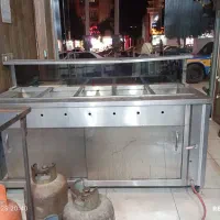 گرمکن غذا یا کانتر گرم و تعدادی وسایل آشکده
