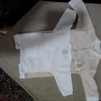 فروش قنداق چسبی نو و اغوشی سویسی در حد نو|کفش و لباس بچه|کرمان, |دیوار