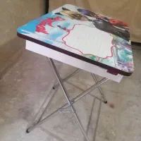 ماشین شارژی و میز تحریر