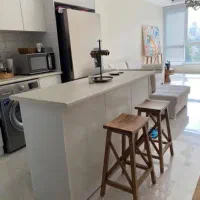 تعدادی میز و صندلی اپن تماما چوبی ،لوستر،کافی بار.