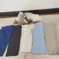 تعدادی شلوار مردانه  واسکاچ  و یک عدد عکس قرآنی