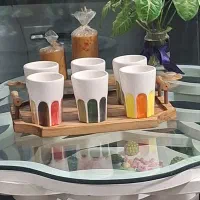 ظروف چوبی و سرامیکی و تعدادی مجسمه واکسسوری