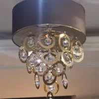 سه عدد لوستر و صندلی راک و کنسول