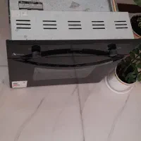 فر توکار  با کار کرد گاز و برق نمای فر شیشه مشکی