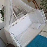 تخت نوزادی کنار مادر