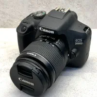 دوربین کنون 2000D به همراه لنز 18-55 در حد آک