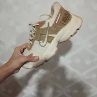 کتانی اکبند|کیف، کفش، کمربند|قم, دروازه ری|دیوار