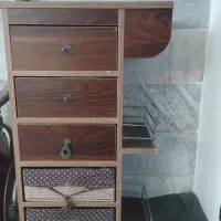 یک عدد سبد سیب زمینی پیاز و میز اتو