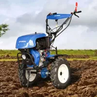 شخم زدن با تیلر و امور باغبانی