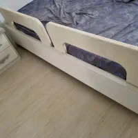 محافظ کودک در تختخواب