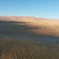 زمین‌لب‌جاده‌اصلی‌روبروی‌شهرک‌صنعتی‌جای‌دوکیسه‌نصف