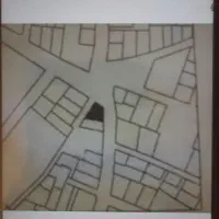 زمین-چهار-دیواری-سه-نبش-با-مغازه-نیم-کاره