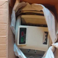 یک عدد دستگاه پول شمار